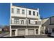 Modern three-story townhouse with private balconies and garage access at 2030 Main Nw St # 207, Atlanta, GA 30318