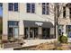 Building's storefront featuring plants, staircase and seating for customers at 2030 Main Nw St # 207, Atlanta, GA 30318