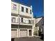 Modern three-story townhouse with private balconies and garage access at 2030 Main Nw St # 207, Atlanta, GA 30318