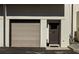 Garage door and entry door of a modern-style townhouse with exterior gas meter at 2030 Main Nw St # 207, Atlanta, GA 30318