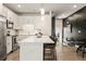 Modern kitchen featuring white cabinets, stainless steel appliances, and a large island with counter seating at 2030 Main Nw St # 207, Atlanta, GA 30318