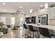 Open-concept living space with modern furnishings, a ceiling fan, and a large island with barstool seating at 2030 Main Nw St # 207, Atlanta, GA 30318