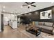 Spacious living area with dark accent wall, recessed lighting, and open flow to the kitchen at 2030 Main Nw St # 207, Atlanta, GA 30318