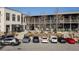 Large parking lot in front of commercial buildings and storefronts at 2030 Main Nw St # 207, Atlanta, GA 30318