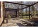 Outdoor picnic area featuring multiple picnic tables with brick structure ruins and surrounding trees at 2030 Main Nw St # 207, Atlanta, GA 30318