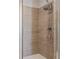 Bathroom features a shower with grey vertical tile, and white base at 2030 Main Nw St # 207, Atlanta, GA 30318