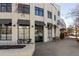 Exterior view of a storefront with outdoor seating and ample natural light at 2030 Main Nw St # 207, Atlanta, GA 30318