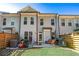Charming backyard with a well-maintained lawn and patio seating area perfect for outdoor gatherings at 5018 Towneship Creek Rd, Roswell, GA 30075