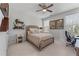 Comfortable bedroom featuring a ceiling fan, neutral color scheme, and natural light from the windows at 5018 Towneship Creek Rd, Roswell, GA 30075