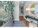 Open foyer with hardwood floors, stylish decor, and a view of the staircase leading upstairs at 5018 Towneship Creek Rd, Roswell, GA 30075