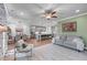 Expansive living area with a fireplace, seating, and views into the kitchen and dining spaces at 5018 Towneship Creek Rd, Roswell, GA 30075
