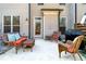Inviting outdoor patio with comfortable wicker furniture, perfect for relaxing and entertaining guests at 5018 Towneship Creek Rd, Roswell, GA 30075