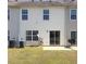A view of backyard featuring a sliding glass door, patio, and space for outdoor activities at 7229 Georges Way, Morrow, GA 30260