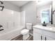 Bathroom with tub/shower combo, granite countertop vanity, framed mirror and vinyl flooring at 7229 Georges Way, Morrow, GA 30260