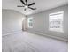 Large main bedroom features neutral carpet, vaulted ceiling with fan, and bright windows. Door to bathroom visible at 7229 Georges Way, Morrow, GA 30260