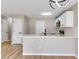Stylish kitchen with white cabinets, a quartz countertop island, and stainless steel appliances at 7229 Georges Way, Morrow, GA 30260