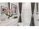 Bathroom features shower/tub combo with patterned shower curtain and white vanity at 113 Chestnut Trce # 8, Hapeville, GA 30354