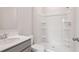 Clean bathroom with modern tub, shower stall, and light gray vanity at 113 Chestnut Trce # 8, Hapeville, GA 30354