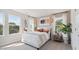 Inviting bedroom with large windows, stylish lighting, and comfortable bed creating a peaceful and relaxing haven at 113 Chestnut Trce # 8, Hapeville, GA 30354