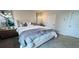 Cozy bedroom with a plush bed, stylish decor, soft carpet, and modern lighting fixtures at 113 Chestnut Trce # 8, Hapeville, GA 30354