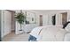 Spacious bedroom with neutral tones, decorative plant, and open doorway creating a serene atmosphere at 113 Chestnut Trce # 8, Hapeville, GA 30354
