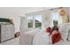 Bright bedroom featuring three large windows, neutral walls, carpeted floors and stylish decor at 113 Chestnut Trce # 8, Hapeville, GA 30354