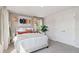 Bright bedroom featuring a large picture, neutral walls, carpeted floors and stylish decor at 113 Chestnut Trce # 8, Hapeville, GA 30354