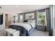 Cozy bedroom featuring soft lighting, large windows, and stylish decor for a comfortable living space at 113 Chestnut Trce # 8, Hapeville, GA 30354