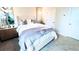 Cozy bedroom with a plush bed, stylish decor, soft carpet, and modern lighting fixtures at 113 Chestnut Trce # 8, Hapeville, GA 30354