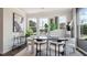 Bright dining room with modern decor, stylish lighting, and large windows at 113 Chestnut Trce # 8, Hapeville, GA 30354