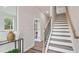 Welcoming foyer featuring modern accents, elegant mirror, and access to staircase at 113 Chestnut Trce # 8, Hapeville, GA 30354