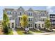 Modern townhouse exteriors showcasing gray siding, white brick accents, and well-manicured landscaping at 113 Chestnut Trce # 8, Hapeville, GA 30354