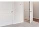 Hallway, white doors, beige carpet at 113 Chestnut Trce # 8, Hapeville, GA 30354