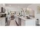 Open concept kitchen showcases stainless steel appliances, large island, and seamless flow to living space at 113 Chestnut Trce # 8, Hapeville, GA 30354