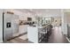 Spacious kitchen boasts stainless steel appliances, expansive island, and access to living area at 113 Chestnut Trce # 8, Hapeville, GA 30354