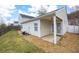 View of the fenced-in backyard with patio and green grass at 115 Oak Grove Pl, Acworth, GA 30102