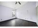 Empty bedroom featuring dark wood floors and ceiling fan at 115 Oak Grove Pl, Acworth, GA 30102