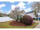Charming home featuring a well-maintained front yard with colorful landscaping at 115 Oak Grove Pl, Acworth, GA 30102