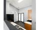 Bright kitchen featuring modern appliances, white countertops, and dark wood floors at 115 Oak Grove Pl, Acworth, GA 30102