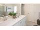 Bathroom with double vanity and a glass-enclosed shower, offering a clean and modern aesthetic at 2698 Ne Almand Ne Ln, Conyers, GA 30013