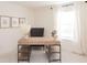 Bright home office with modern wood desk, shelving, and natural light, perfect for a workspace at 2698 Ne Almand Ne Ln, Conyers, GA 30013