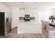 Contemporary kitchen with white cabinets, stainless steel appliances, and a center island at 2698 Ne Almand Ne Ln, Conyers, GA 30013