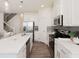 Modern kitchen featuring white cabinetry, stainless steel appliances, and a center island with sink at 2698 Ne Almand Ne Ln, Conyers, GA 30013