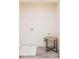 Functional laundry area with tile floor, a utility sink, and essential connections at 2698 Ne Almand Ne Ln, Conyers, GA 30013