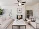 Elegant living room with a fireplace, modern decor, and comfortable seating arrangement at 2698 Ne Almand Ne Ln, Conyers, GA 30013