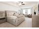 Spacious main bedroom with a tray ceiling, neutral tones, carpet, and large windows at 2698 Ne Almand Ne Ln, Conyers, GA 30013