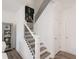 Bright staircase featuring black metal railings, white accents, and a modern design at 2698 Ne Almand Ne Ln, Conyers, GA 30013