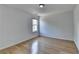 Bright bedroom with hardwood floors and a window letting in natural light at 3517 Harvest Ridge Ln, Buford, GA 30519