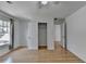 Bedroom features hardwood floors, ceiling fan, window, closet, and white paint at 3517 Harvest Ridge Ln, Buford, GA 30519