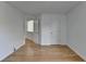 Spacious, bright bedroom with hardwood floors, white trim and an open doorway at 3517 Harvest Ridge Ln, Buford, GA 30519